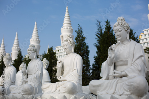 The beautiful white pagoda is under the blue sky
