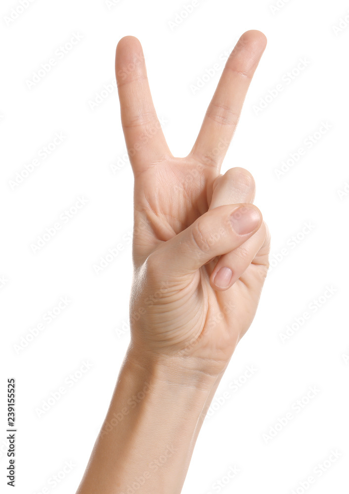 Woman showing two fingers on white background, closeup of hand Woman showing two fingers on white background, closeup of hand
