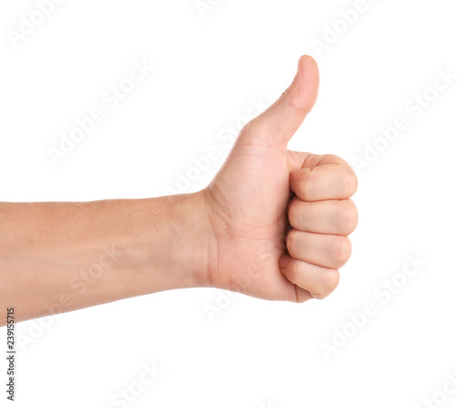 Slika na platnu Man showing thumb up gesture on white background, closeup of hand