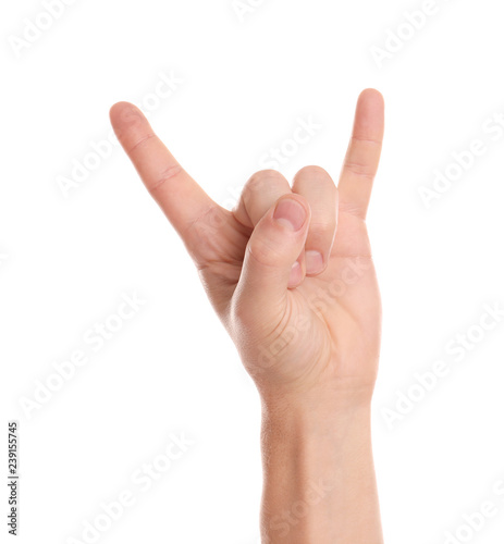 Man showing rock gesture on white background, closeup of hand