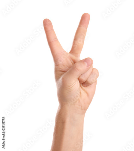 Man showing two fingers on white background, closeup of hand