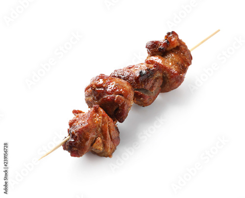 Skewer with delicious barbecued meat on white background