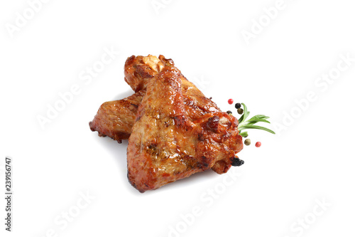 Delicious barbecued chicken wings on white background