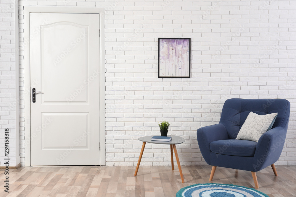 Light room interior with white door in brick wall Light room interior with white door in brick wall