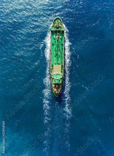 Aerial top view Oil ship tanker full speed transport oil or fuel from refinery on the sea.