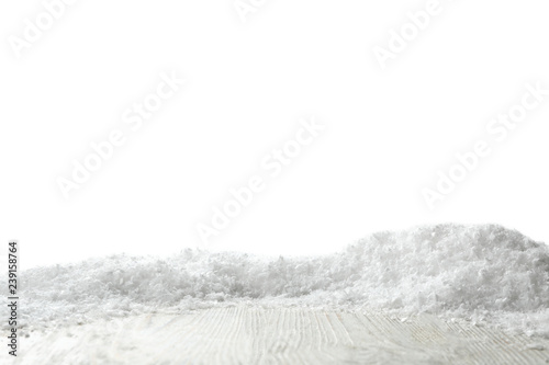 Wooden surface covered with snow against white background