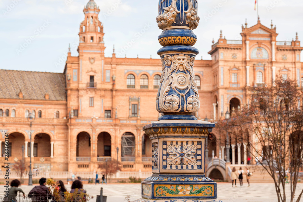 Touristic landmark with columns with ceramic tiles and walls of the famous Plaza de Espana, example of architecture of Andalusia, Sevilla
