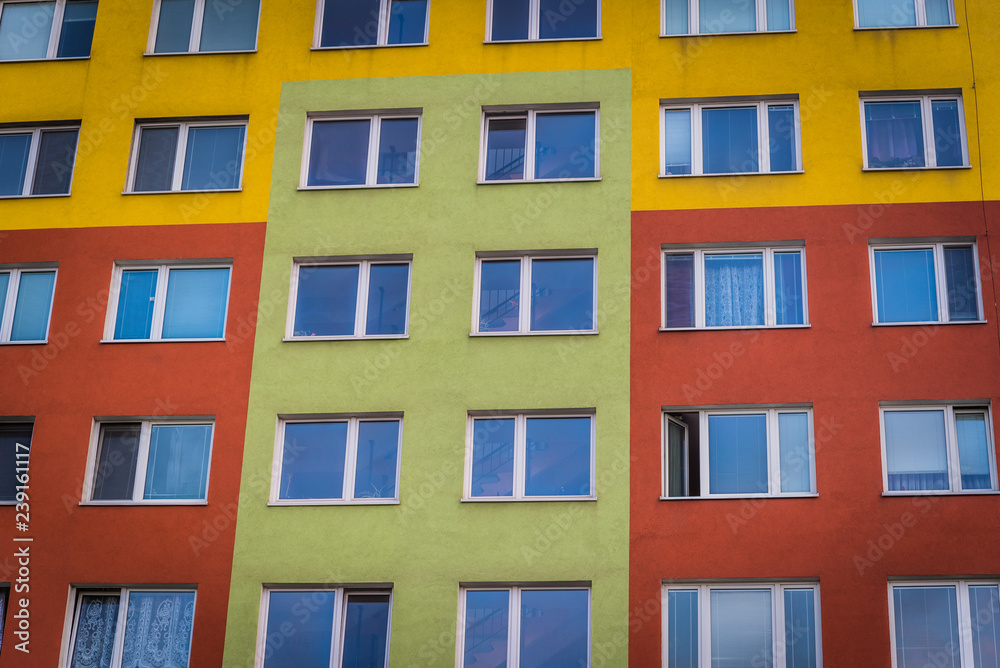 Colorful facade of high modern apartment building. Real estate background