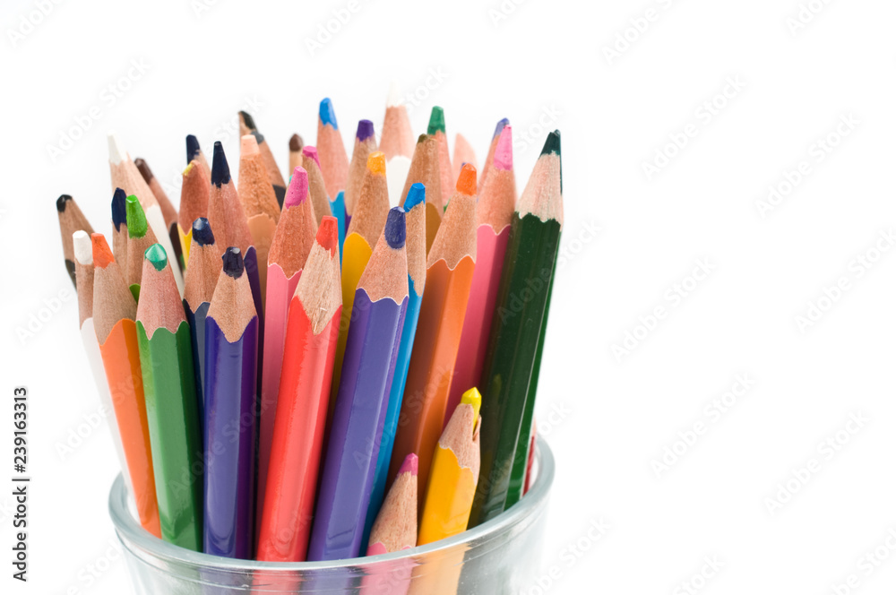 Bunch of colored pencils isolated on white background. Selective focus. Bunch of colored pencils isolated on white background. Selective focus.