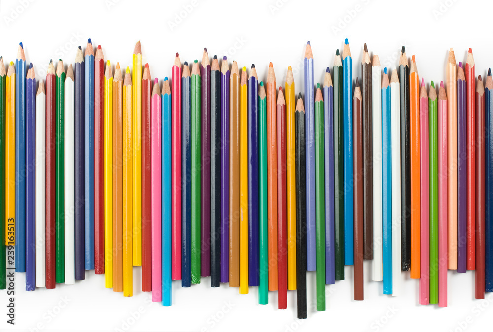 Colored pencils in a row isolated on white background. Colored pencils in a row isolated on white background.