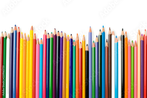 Colored pencils in a row isolated on white background.