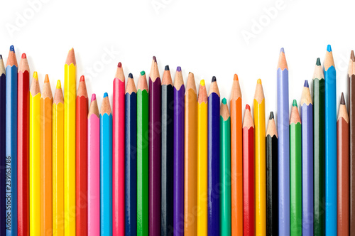 Colored pencils in a row isolated on white background.