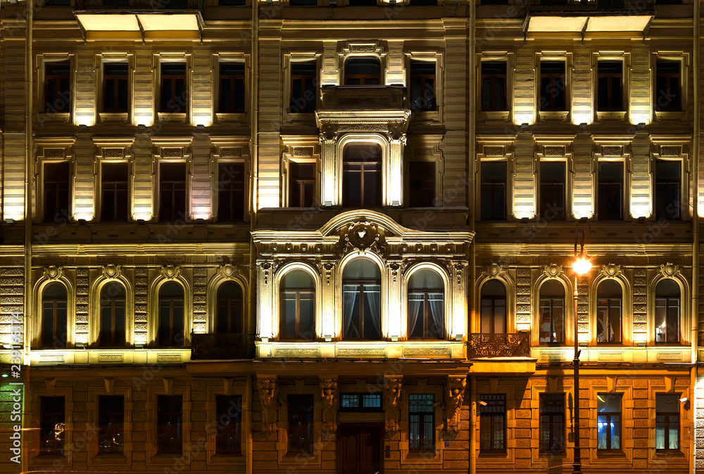 St. Petersburg facade of the historical building in Baroque style, night illumination, Neva embankment