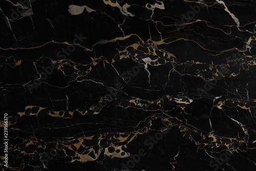 Black polished marble with yellow veins Nero Portoro as background