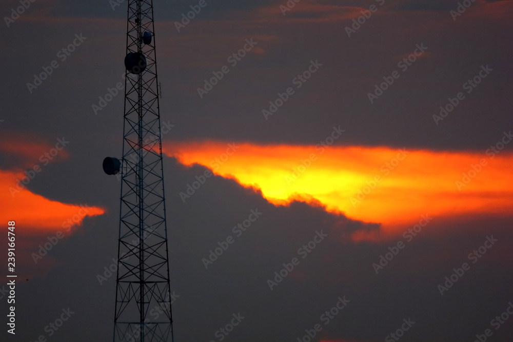 Fototapeta premium the telacommunication pole or mobile pole with sun set sky background