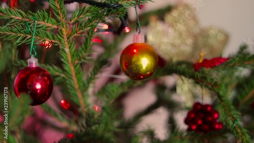 Christmas decorations on christmas Tree. Red Lights pop 