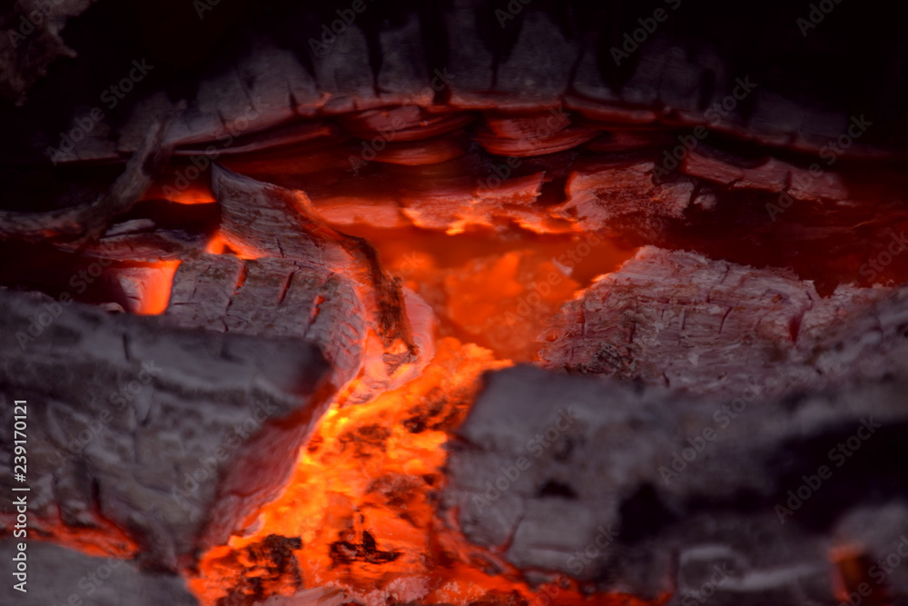 abstract burning firewood close up view, red glowing pieces of firewood in a indoor fireplace abstract macro shot abstract burning firewood close up view, red glowing pieces of firewood in a indoor fireplace abstract macro shot