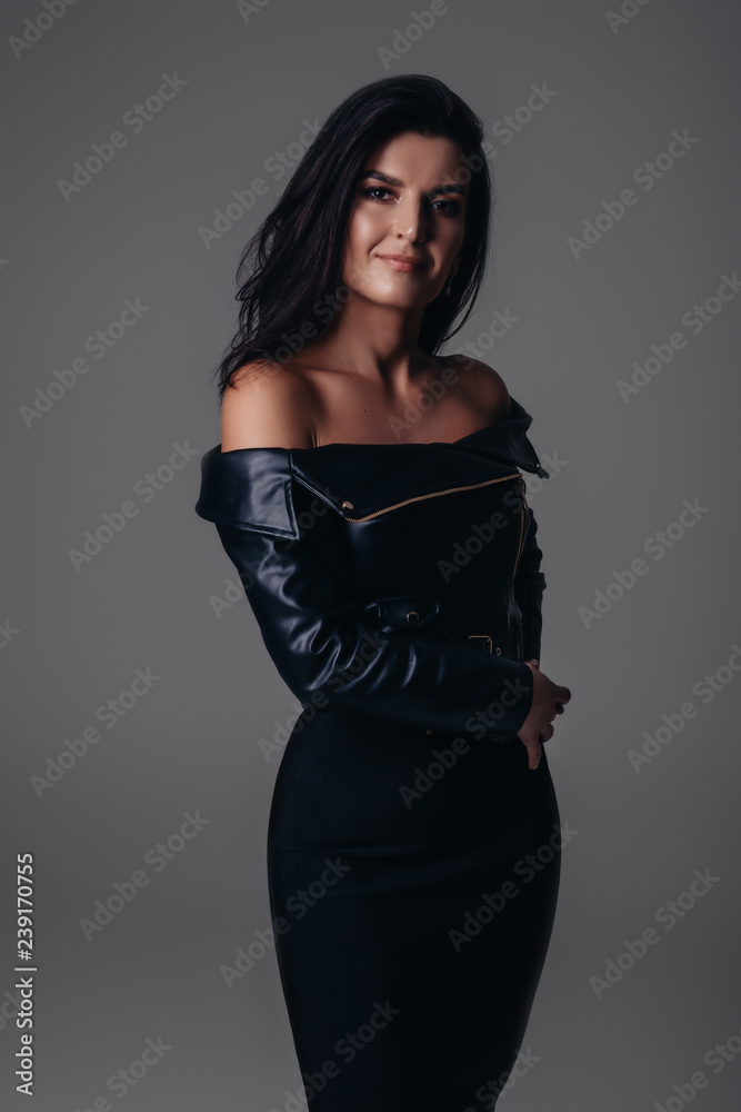 Fashion model, gray background, model in black Fashion model, gray background, model in black