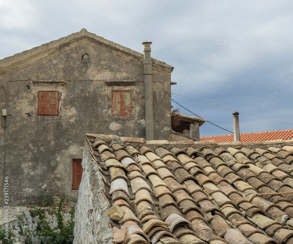 Old traditional stone house and roof in Village Krini, corfu, greece, vintage look