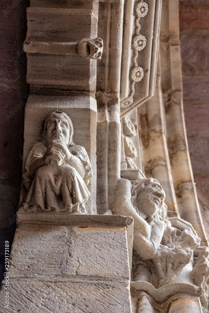 Entrance door of Notre-Dame-du-Bout-du-Pont Church in the town of Saint-Jean-Pied-de-Port, France on the Camino de Santiago, Way of St. James, architectural exterior detail, selective focus