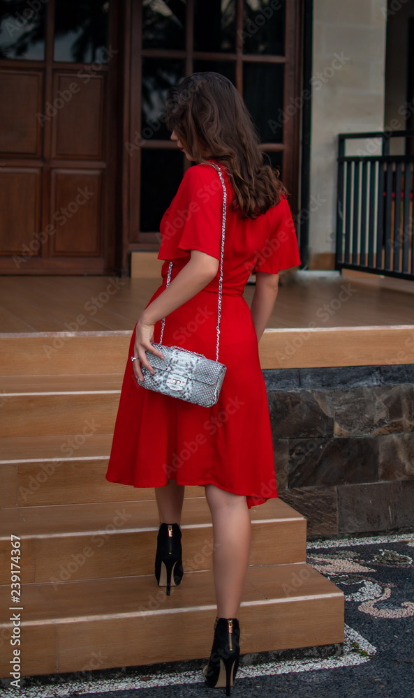 Red dress and accessories arranged on the floor.Woman pleated dress with  accessories, purse, hat, high heel shoes and vintage sunglasses. Stock  Photo | Adobe Stock