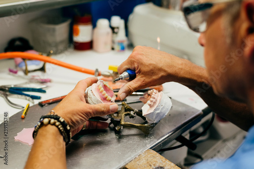 Caucasian man working on a dental prosthesis