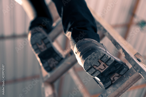 Engineering engineers are climbing stairs in the construction site.