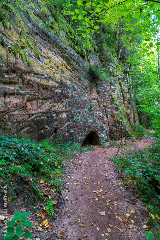 sandstone cliffs with tourist trail on river of gauja, Latvia sandstone cliffs with tourist trail on river of gauja, Latvia