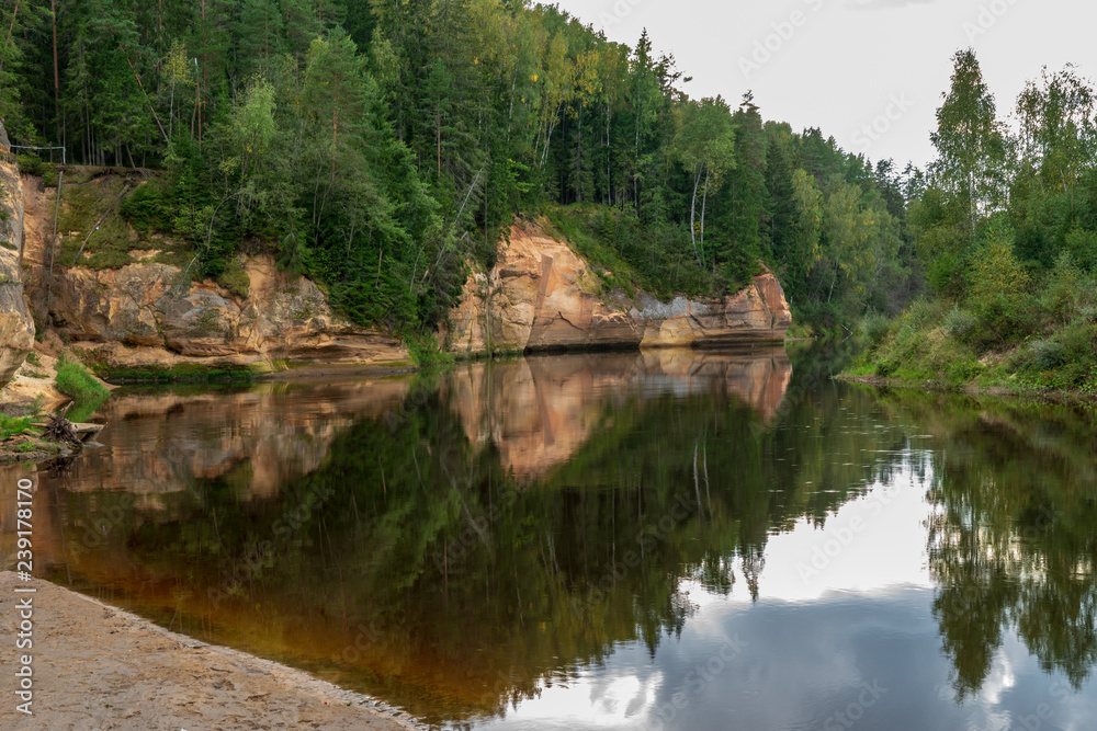 Fototapeta premium sandstone cliffs with tourist trail on river of gauja, Latvia