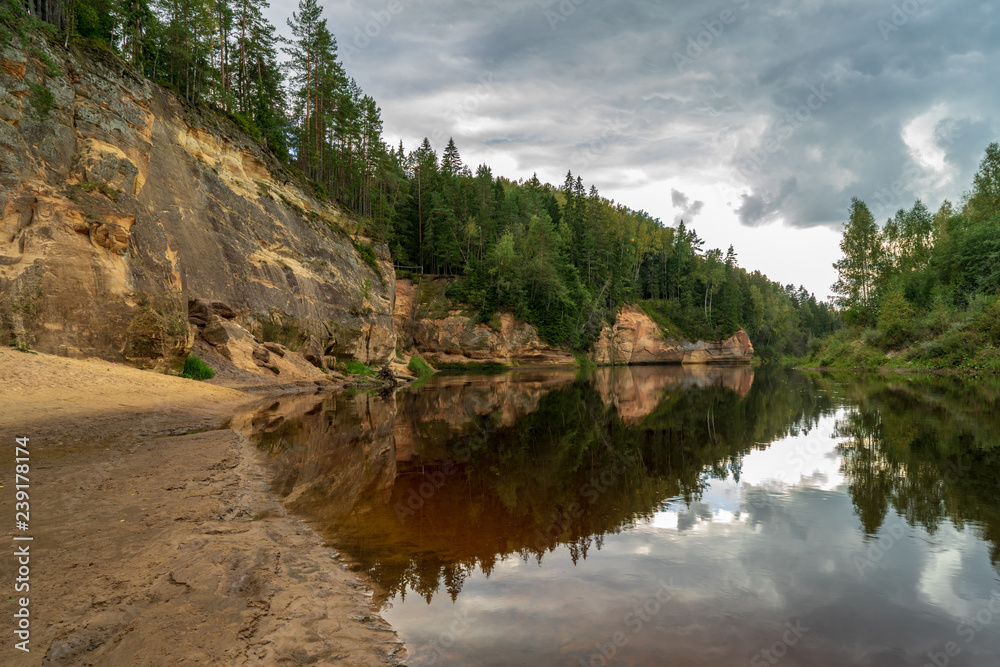 sandstone cliffs with tourist trail on river of gauja, Latvia