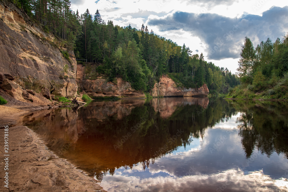 Fototapeta premium sandstone cliffs with tourist trail on river of gauja, Latvia
