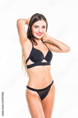 Portrait of happy beautiful fit woman in black bikini isolated on white background © dianagrytsku