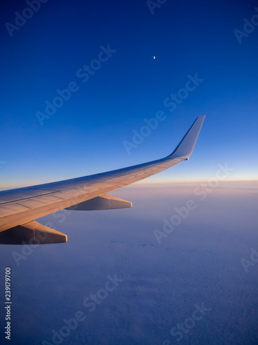 Moon rising over the wing