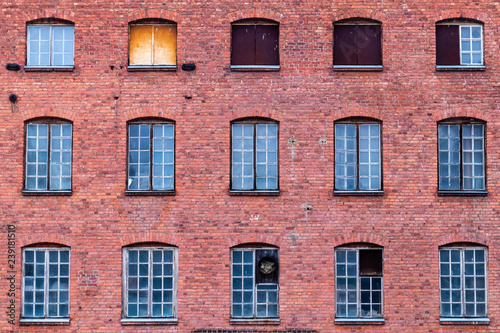 Windows on red brick wall