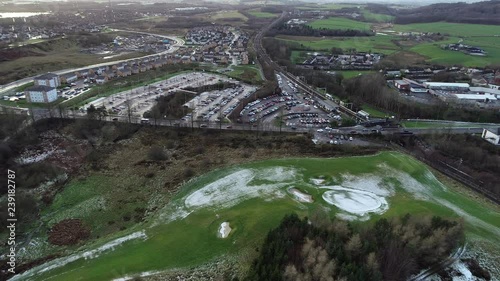 Low level aerial footage, static, over Croy railway station on the Glasgow to Edinburgh line. photo