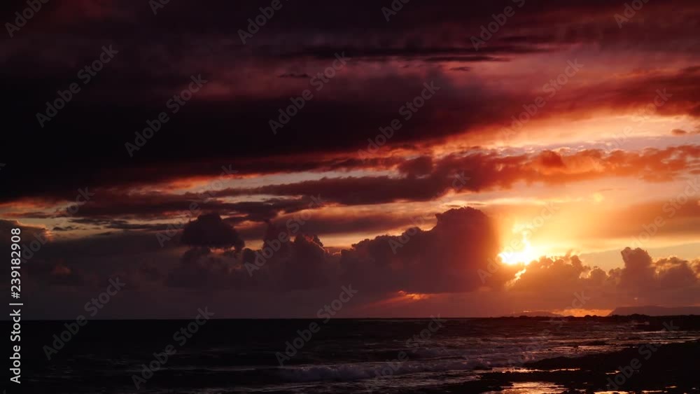 Scenic sunset over sea surface with dark stormy rainy clouds, Greece Peloponnese Scenic sunset over sea surface with dark stormy rainy clouds, Greece Peloponnese