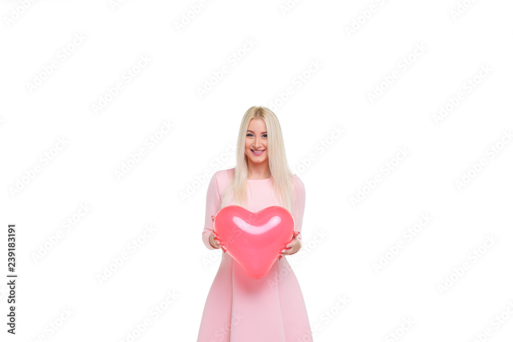 Beautiful young blond woman with heart shape pink air balloon on white isolated background. Woman on Valentine's Day. Symbol of love - Image. Space for text Beautiful young blond woman with heart shape pink air balloon on white isolated background. Woman on Valentine's Day. Symbol of love - Image. Space for text