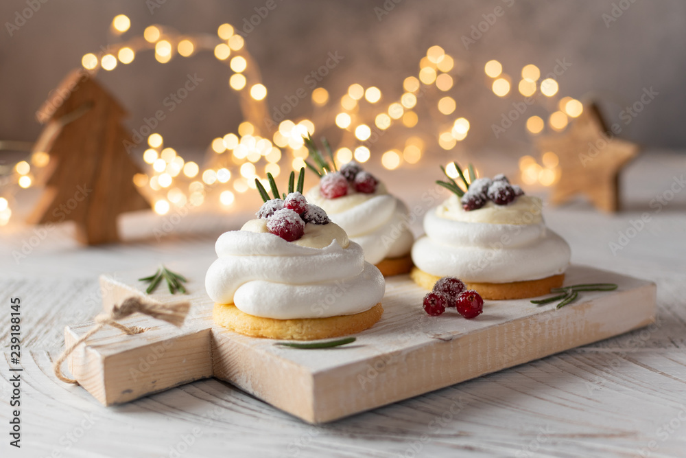 Pavlova Cake with berry cranberries on white background