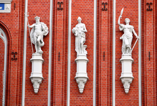 Gods Statues at the famous House of the Blackheads. The original building was erected during the first third of the 14th century for the Brotherhood of Blackheads, Riga, Latvia photo