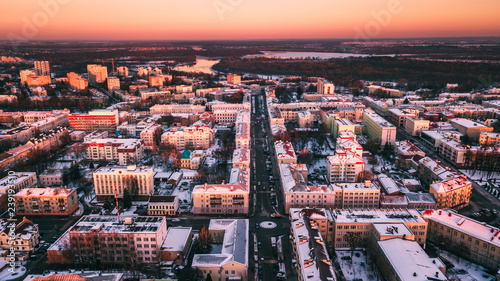 Beautiful sunset on the background of a European city with a copter. Gomel. Belarus.
