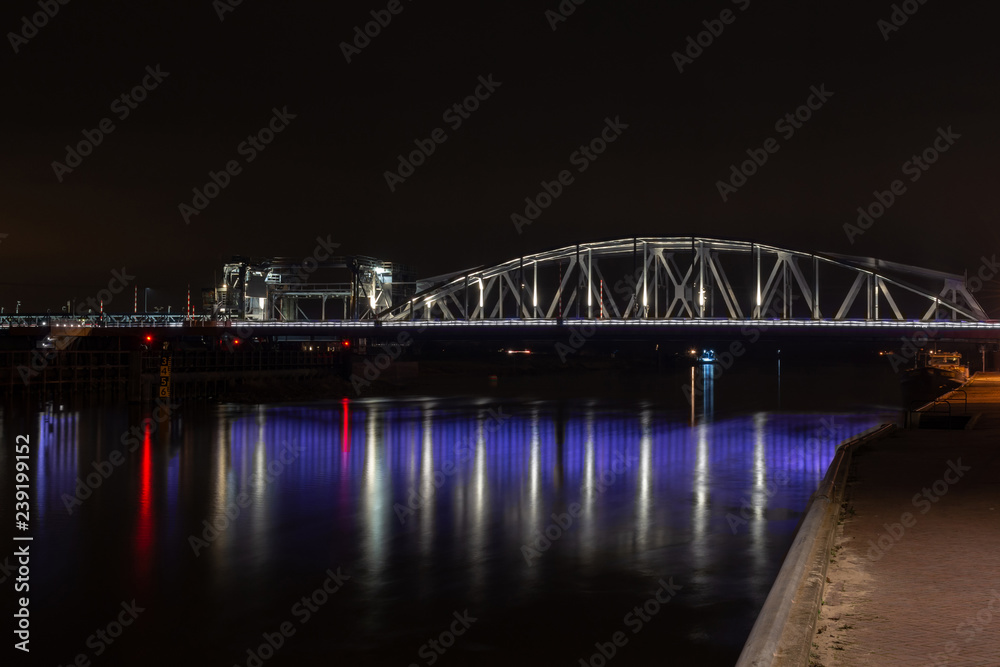 Oude IJssel bridge with the railway bridge at Zutphen at night