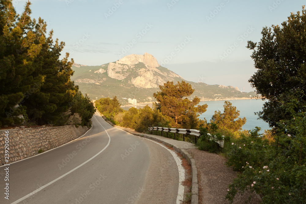 Fototapeta premium View of the road, the Black sea and Ilyas-Kaya mountain on the southern coast of Crimea.