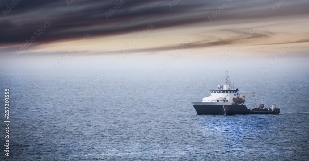 Homecoming: Tired fishermans ship approaching after a hard day Homecoming: Tired fishermans ship approaching after a hard day