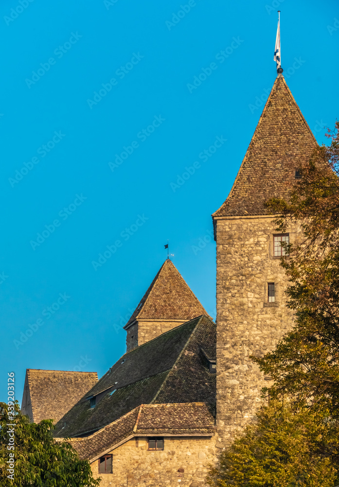 The defense tower of the Rapperswil castle, a medieval fortress dominantinhg the skyline of the old city on the shores of the Upper Zurich Lake (Obersee), Sankt Gallen, Switzerland