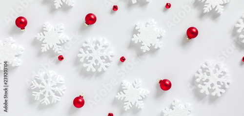 Christmas trendy composition. Xmas red and white decorations on white background. Christmas, New Year, winter concept. Flat lay, top view, copy space, banner