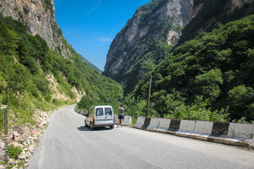 Travel by car through the high ridges of the Caucasus Mountains.