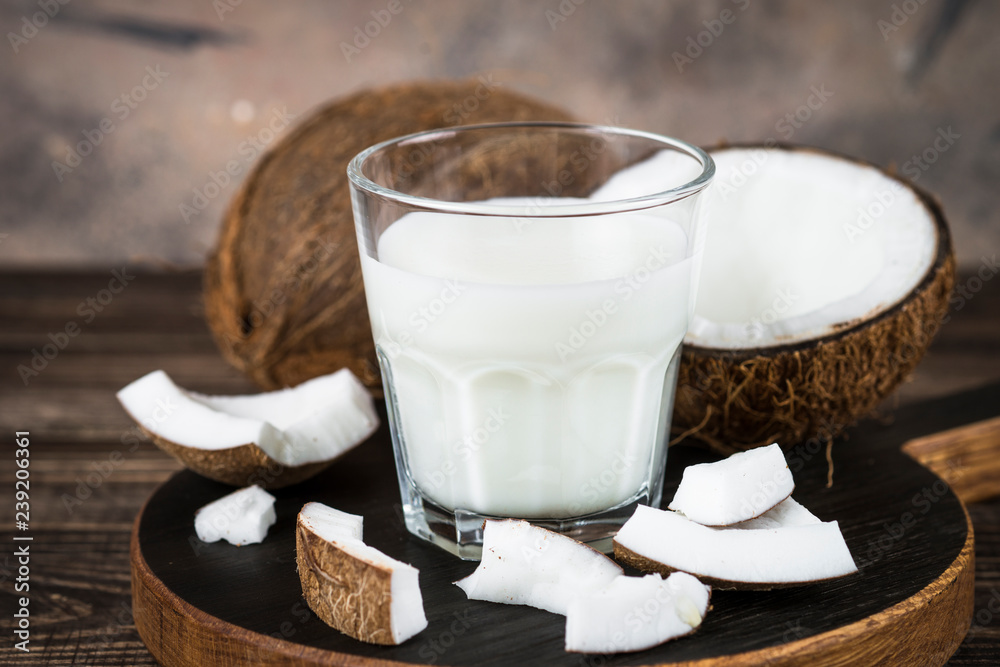 Coconut milk in glass, Vegan milk. Coconut milk in glass, Vegan milk.