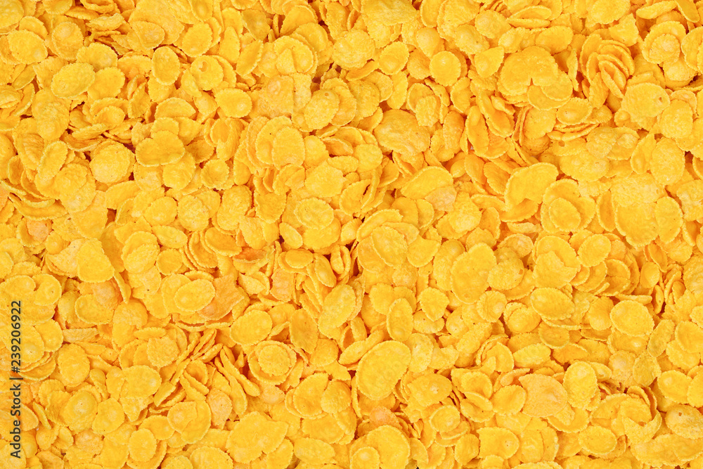 Corn-flakes background and texture. Top view. cornflake cereal box for morning breakfast. Corn-flakes background and texture. Top view. cornflake cereal box for morning breakfast.