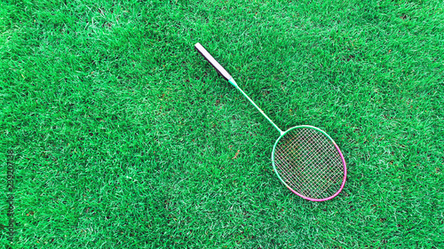 badminton racket on grass