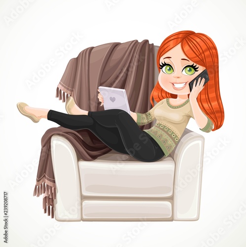 Cute girl sitting in comfortable chair with a plaid and talking on mobile phone while holding tablet in her other hand isolated on white background